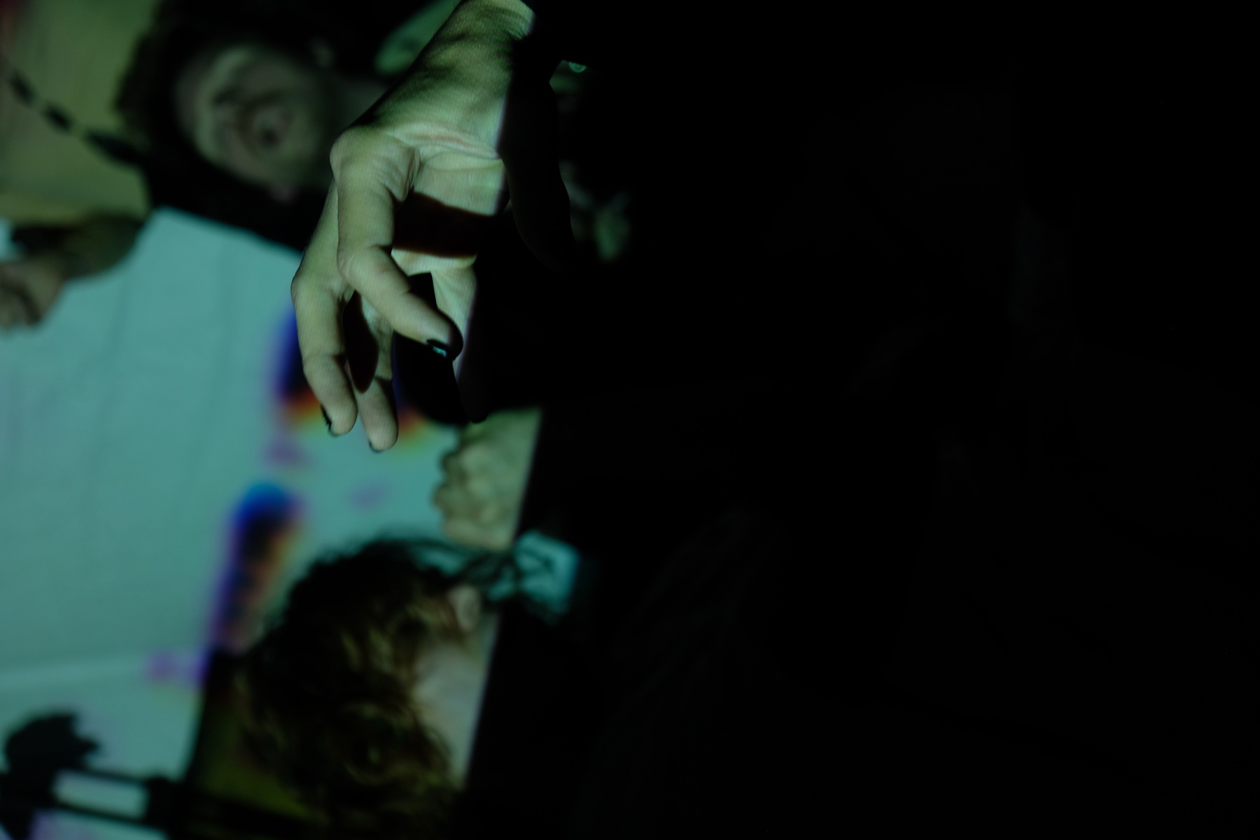 Projected image and participants inside TheFool Berlin.