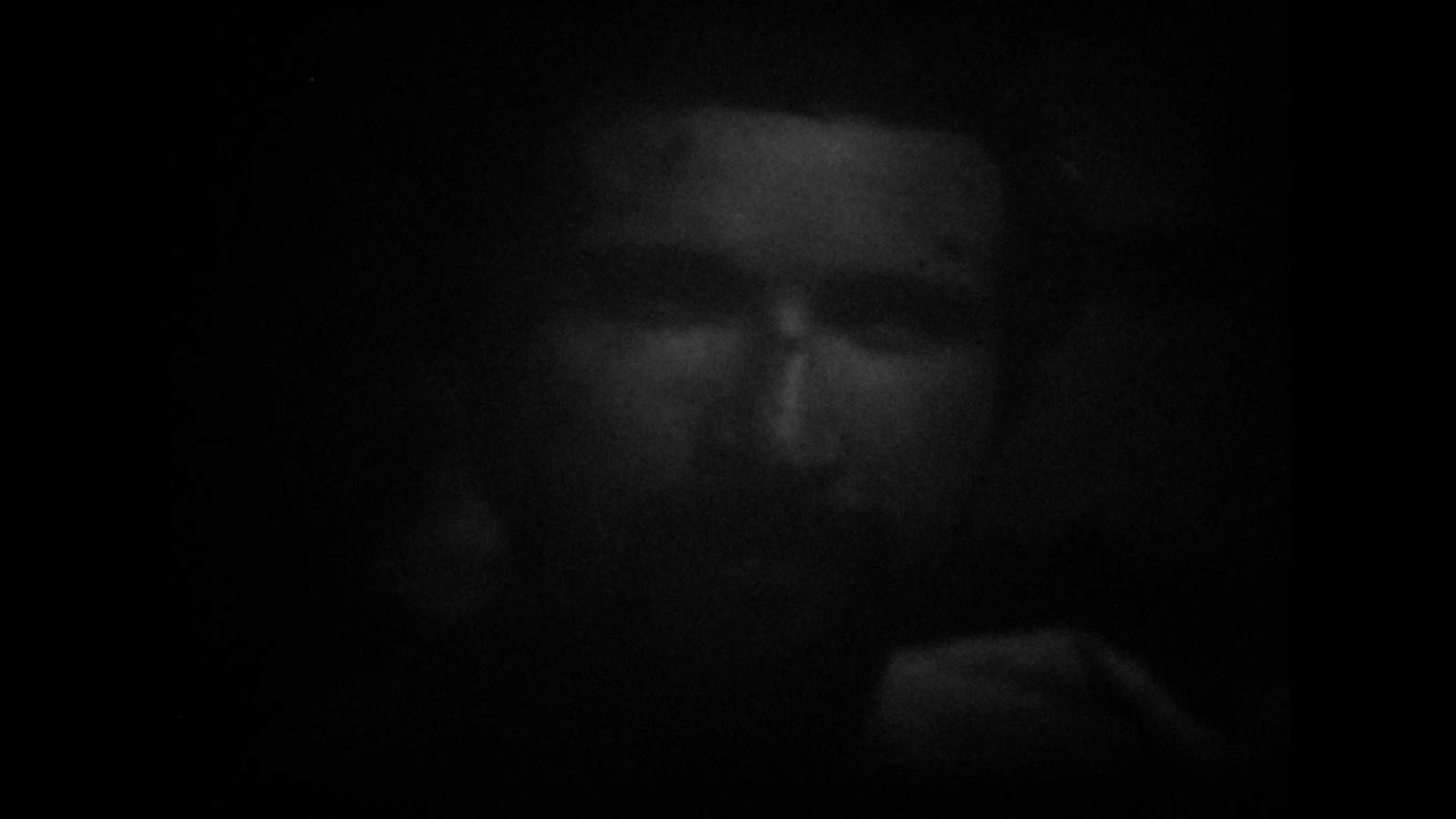 Dim apparition emerging from black in Skull And Stare Alone.